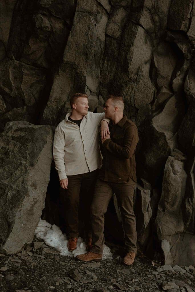 A male couple embraces during their proposal in Iceland